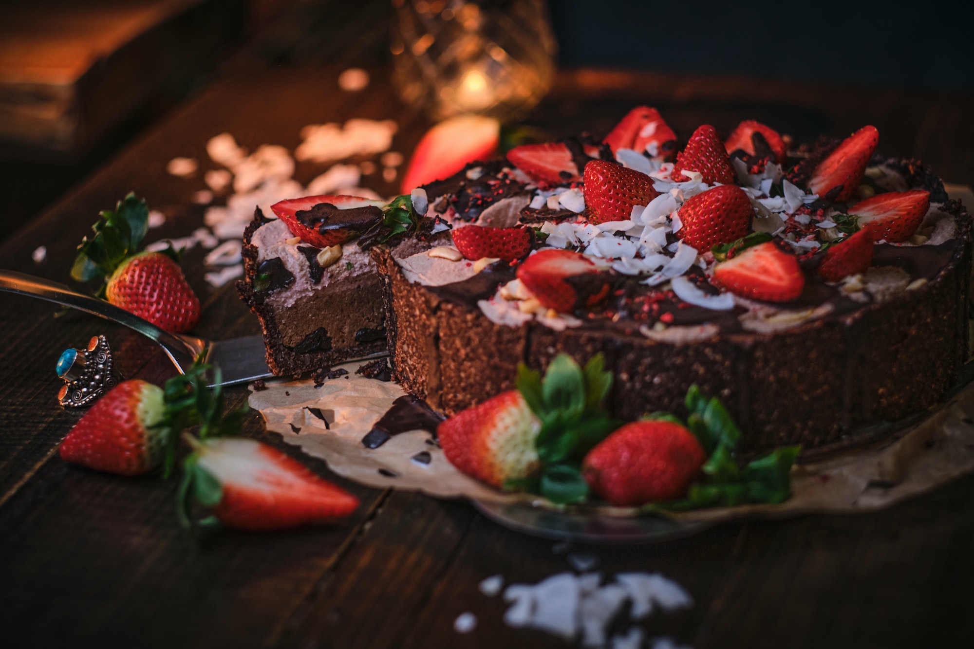 Vegan and delicious chocolate cake with strawberries on a paper serviette