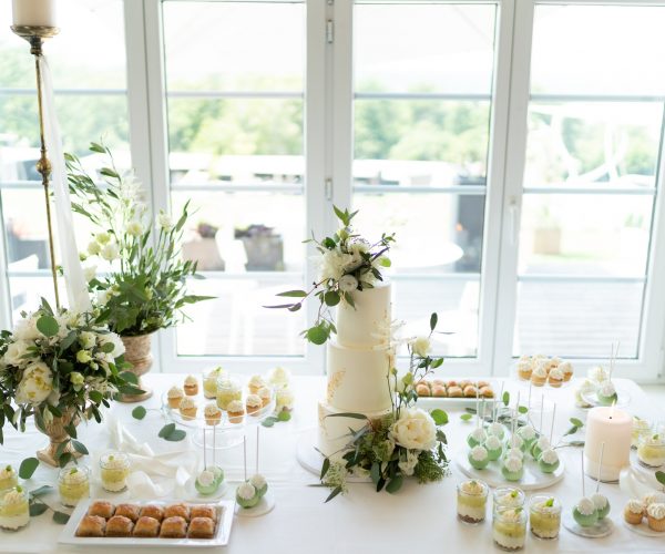 wedding-cake-cupcakes-and-sweets-on-a-nicely-decorated-event-table.jpg